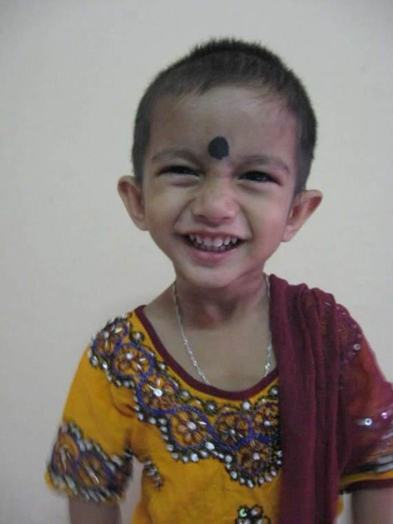 Srijan smiling in festive clothes